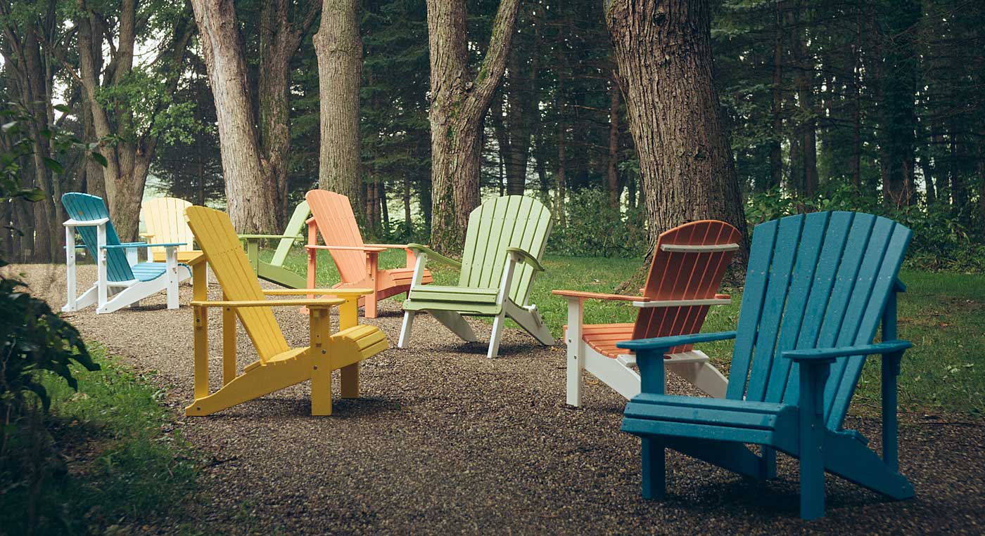 LuxCraft photo of Adirondack chairs in a misty wooded setting